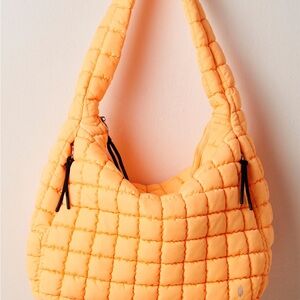 FP Movement by Free People Quilted Hobo Bag in the color, Clementine